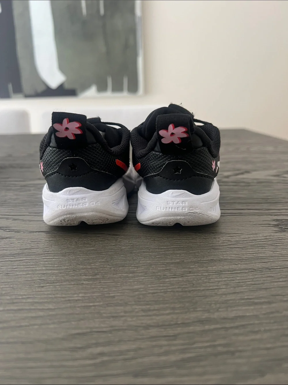 Nike Kids Black Sneakers with White & Red Swoosh and Pink Flower Accents